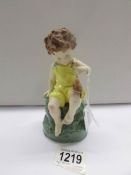 A Royal Worcester figurine 'Friday's Child, Loving and Giving'.