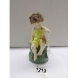 A Royal Worcester figurine 'Friday's Child, Loving and Giving'.