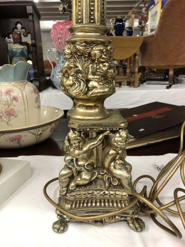 A gilded standard lamp with cherubs on base complete with shade,. - Image 2 of 4