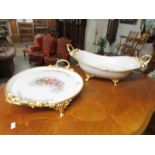 2 fine porcelain bowls with gilt feet and handles.
