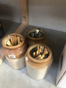 3 earthenware pots with assorted flatware/cutlery.