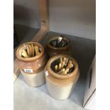 3 earthenware pots with assorted flatware/cutlery.