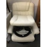 A leather massage chair with stool.