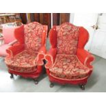 A pair of wing arm chairs.