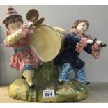 A Majolica style figure group of musical clowns.