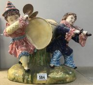 A Majolica style figure group of musical clowns.