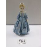 A Royal Worcester figurine 'Grandmother's Dress', modelled by F G Doughty.