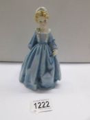 A Royal Worcester figurine 'Grandmother's Dress', modelled by F G Doughty.