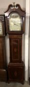 A mahogany inlaid 8 day long case clock with painted arched dial 'John Brown, Harleston'.