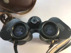 A pair of Carl Zeiss 10x50 binoculars with leather case