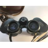 A pair of Carl Zeiss 10x50 binoculars with leather case