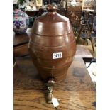 A stoneware barrel with brass tap.