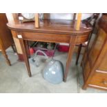 A Victorian mahogany fold over card table.