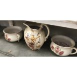 2 floral decorated chamber pots and a jug.