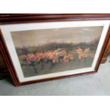 A large framed and glazed print of an early rugby scene.
