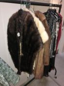 A vintage fur coat, 2 fur stoles and a Frank Usher dress.