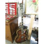 A 1950's Hofner 'Committee' semi acoustic bass guitar.