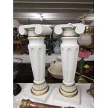 A pair of Grecian style pedestals.