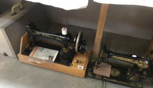 A Singer sewing machine with case plus 1 other.