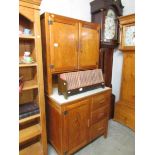 A 1950's stripped pine/ply dresser/kitchen unit with formica top.