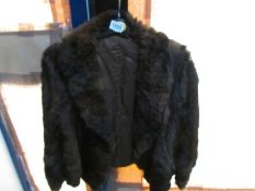 A short fur jacket.