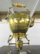A superb quality Victorian brass spirit kettle complete with burner.