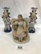 A pair of 19th century continental porcelain figural candle holders and a bisque spill vase.