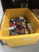 A large box of play worn diecast toys.