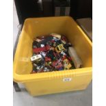 A large box of play worn diecast toys.