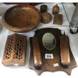 A 1930s oak wall mirror brush set and other treen items.