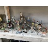 A quantity of assorted early-mid 20th century figures including crested ware ashtray.