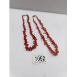 2 coral necklaces.