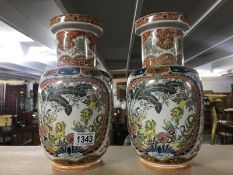 A pair of oriental vases, one a/f.