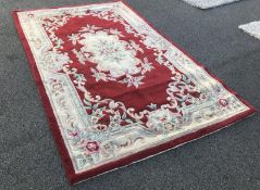 A red patterned rug (length 2.41m x width 1.52m).