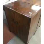 A pair of 1950s walnut 2 door music/record cabinets.