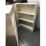 A pair of white painted bookshelves (one with corner extension).