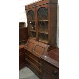 An old wooden cabinet with glazed doors (glass a/f) and 3 drawers.