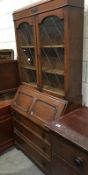 An old wooden cabinet with glazed doors (glass a/f) and 3 drawers.