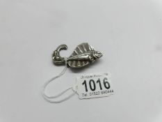 An art deco silver fish brooch.