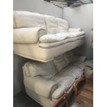 2 cream leather 3 seater sofas.