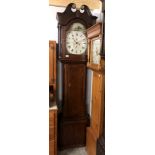 An 8 day long case clock with painted dial 'R.Dunne, Bradford'.