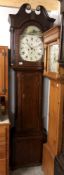 An 8 day long case clock with painted dial 'R.Dunne, Bradford'.