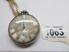 A silver pocket watch with London hall mark for 1865/66 with gold leaf feature.