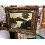 An oil on board painting of a lake scene featuring a hill, initialed P.M.