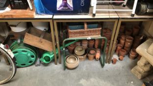 A large quantity of terracotta flower pots, 2 enamel buckets etc.