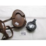 A T.G & Co., 1044 Mk III military compass with original leather case.