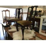 A pair of Edwardian dark wood dining chairs.