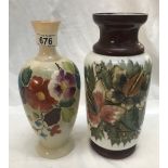 A pair of hand painted glass vases.