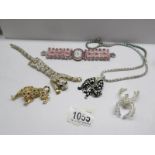 A jewelled tiger bracelet, a leopard brooch, a spider brooch,
