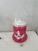 A Mary Gregory style cranberry glass biscuit barrel.